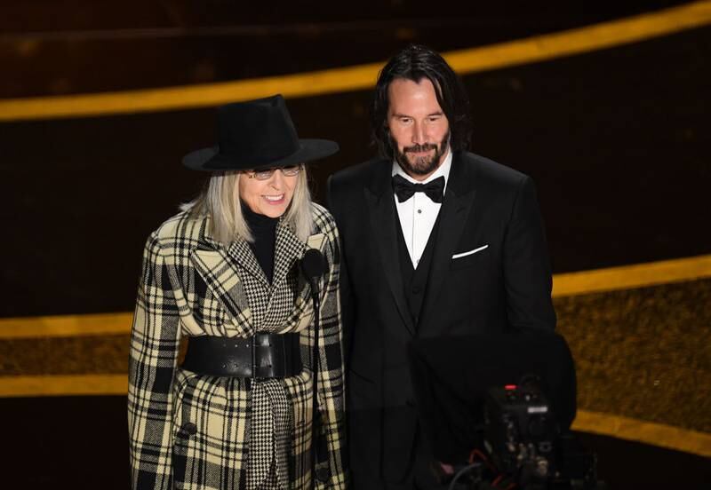 HOLLYWOOD, CALIFORNIA - FEBRUARY 09: (L-R) Diane Keaton and Keanu Reeves speak onstage during the 92nd Annual Academy Awards at Dolby Theatre on February 09, 2020 in Hollywood, California. (Photo by Kevin Winter/Getty Images)