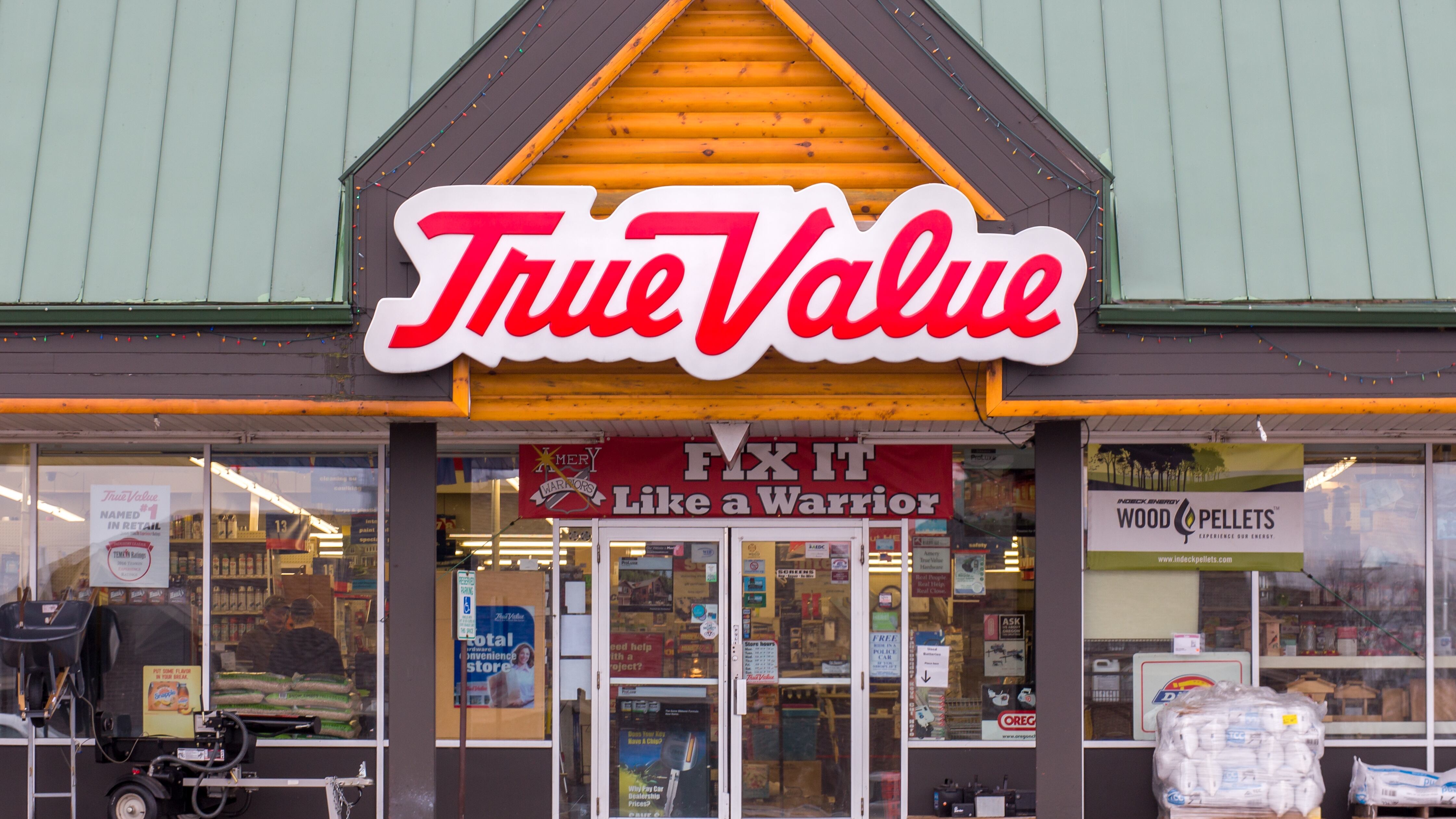 True Value hardware store exterior and logo. The True Value Company is an American retailer-owned hardware cooperative.
