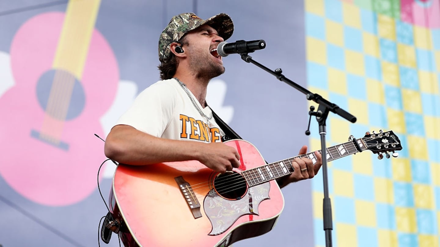 Conner Smith singing on stage